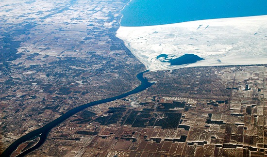 Ice from Lake Huron wedges between Port Huron, Michigan, on he left, and Sarnia, Ontario, on the right. To the bottom, water flows into the lake from the St. Clair River. An International Joint Commission study concluded that water level drops in Lakes Huron and Michigan stemmed from an ice block in the St. Clair during the 1980s.