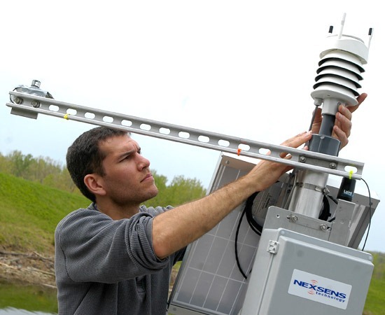 Kevin Rose, a PhD student in Miami University’s Department of Zoology and Lake Scientist co-editor, installs a multi-parameter weather sensor on a new meteorological station on shore near Acton Lake.