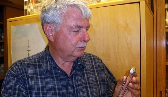 Michigan Technological University biologist Charlie Kerfoot examines a quagga mussel.