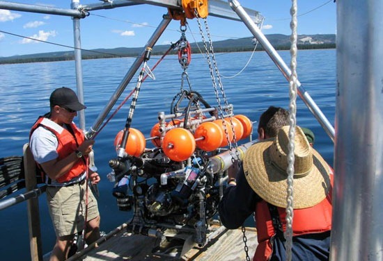 A remotely operated vehicle is prepared for deployment into Yellowstone Lake to help study unique life that has proliferated around a lake-bottom geothermal vent.
