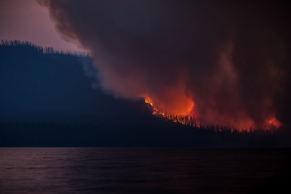 The Howe Ridge Fire seen from across Lake McDonald on the night of August 12th, roughly 24 hours after the fire was started by a lightning strike in an area previously burned in the 2003 Roberts Fir