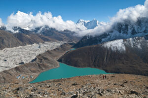 The summit of Gokyo Ri. Ngozumpa glacier, the largest and longest glacier in the Himalayas, is right below, along with commanding views over nearby Cholatse, Taboche, Kangtega, Thamserku and other peaks. Gokyo Ri, Gokyo Lake, Nepal, Himalayas.