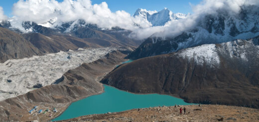 The summit of Gokyo Ri. Ngozumpa glacier, the largest and longest glacier in the Himalayas, is right below, along with commanding views over nearby Cholatse, Taboche, Kangtega, Thamserku and other peaks. Gokyo Ri, Gokyo Lake, Nepal, Himalayas.