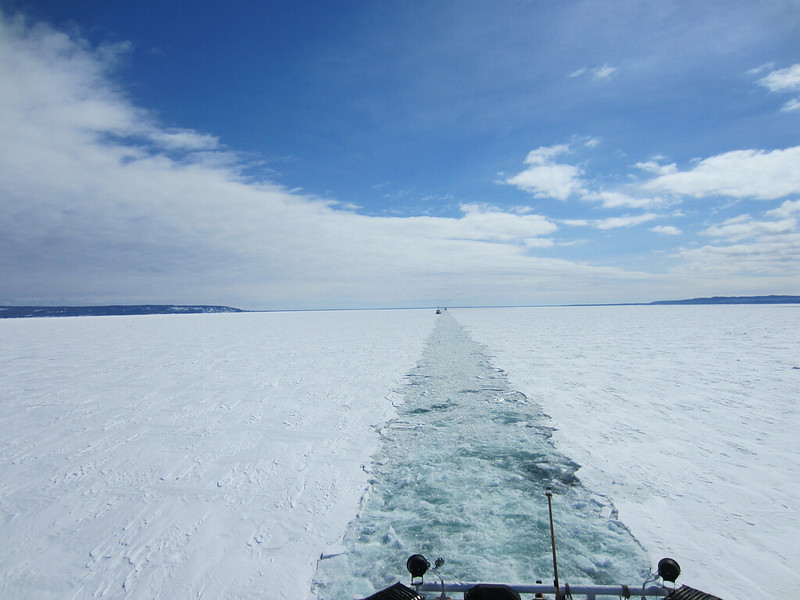 USCG Mackinaw in Lake Superior breaks a path in the ice for freighters travelling from Soo Locks. March 21, 2014. Understanding of Ice cover dynamics in lakes like this are an essential part of winter transport.